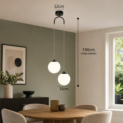 Modern black two-head glass globe pendant light with adjustable 150cm drop, shown in a contemporary dining room setting with technical dimension labels.