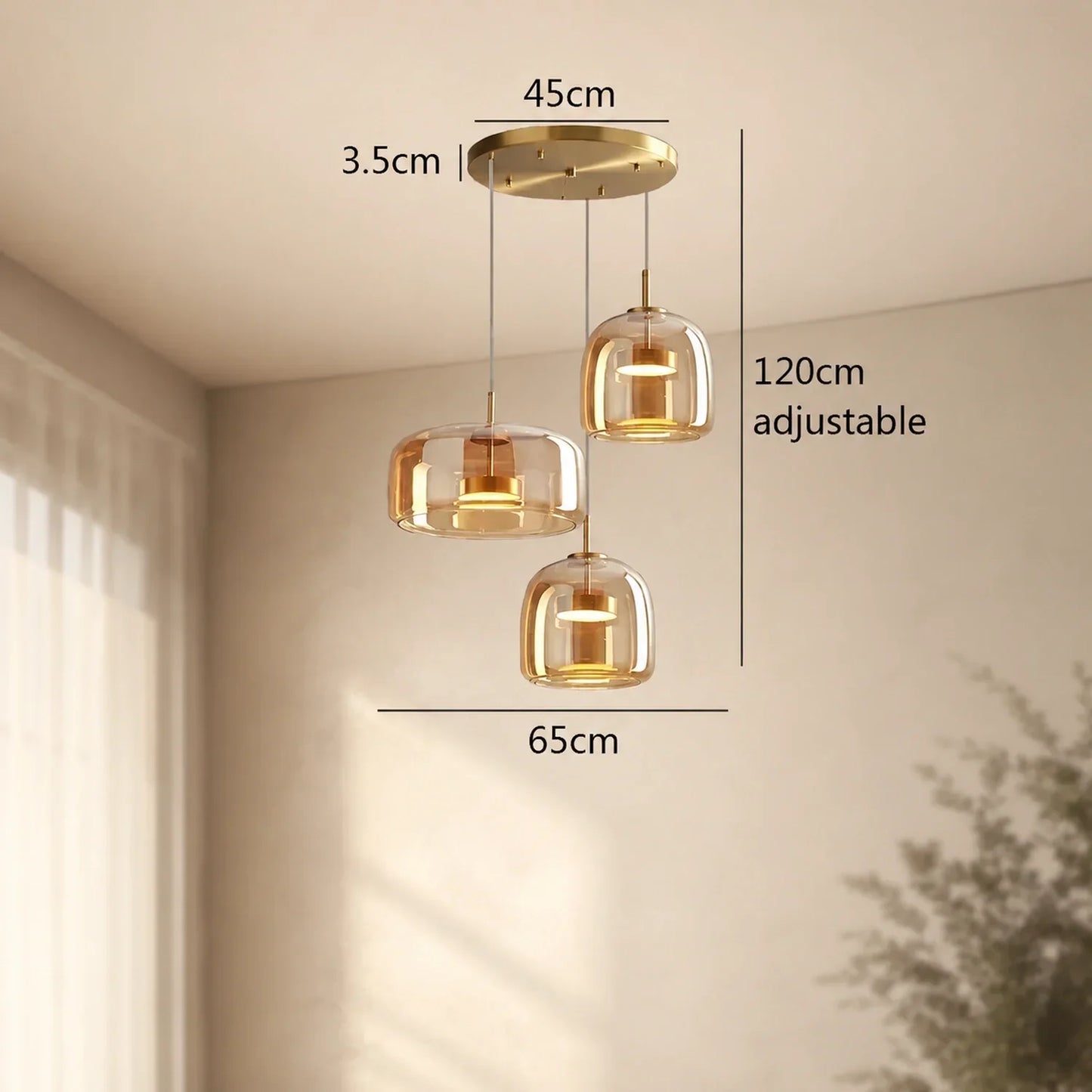 Modern round triple-head amber glass pendant light with gold ceiling plate, showing dimensions of 65cm width and 120cm adjustable drop in a room.