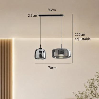 Modern double head smoky grey glass pendant light with adjustable 120cm cables and 70cm total width, shown with technical dimensions in a room setting.