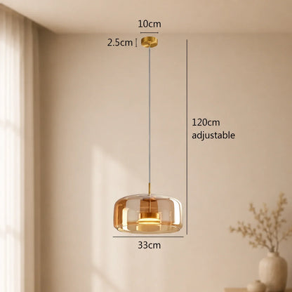 Modern amber glass pendant light with a 33 cm diameter, featuring an adjustable 120 cm cable and gold ceiling rose, shown with technical dimensions.