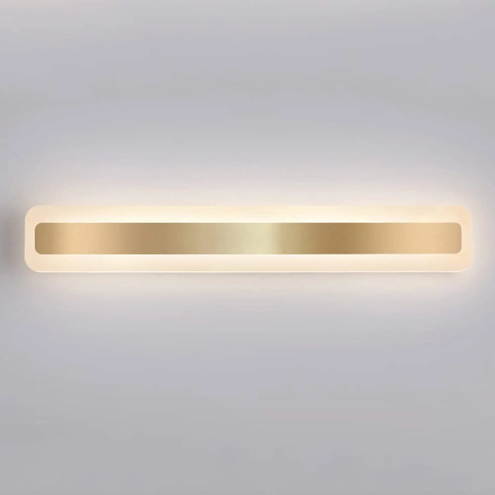 A modern, horizontal LED bathroom wall light featuring a sleek gold finish centre panel with soft, diffused illumination against a plain grey background.