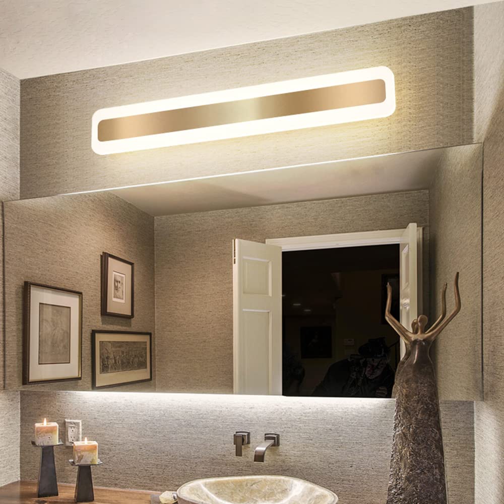 Modern rectangular LED bathroom wall light with a sleek gold finish mounted above a large mirror in a contemporary bathroom setting.