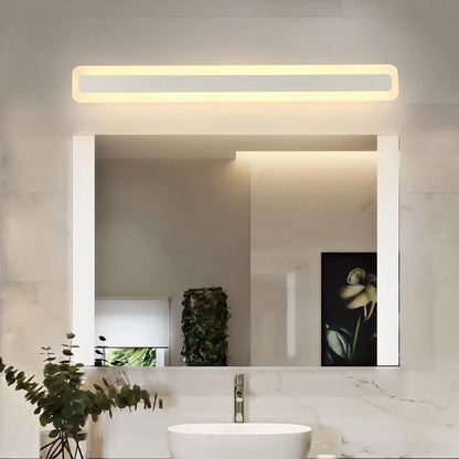 Modern white LED vanity wall light mounted above a bathroom mirror, providing warm illumination in a contemporary marble-tiled bathroom setting.