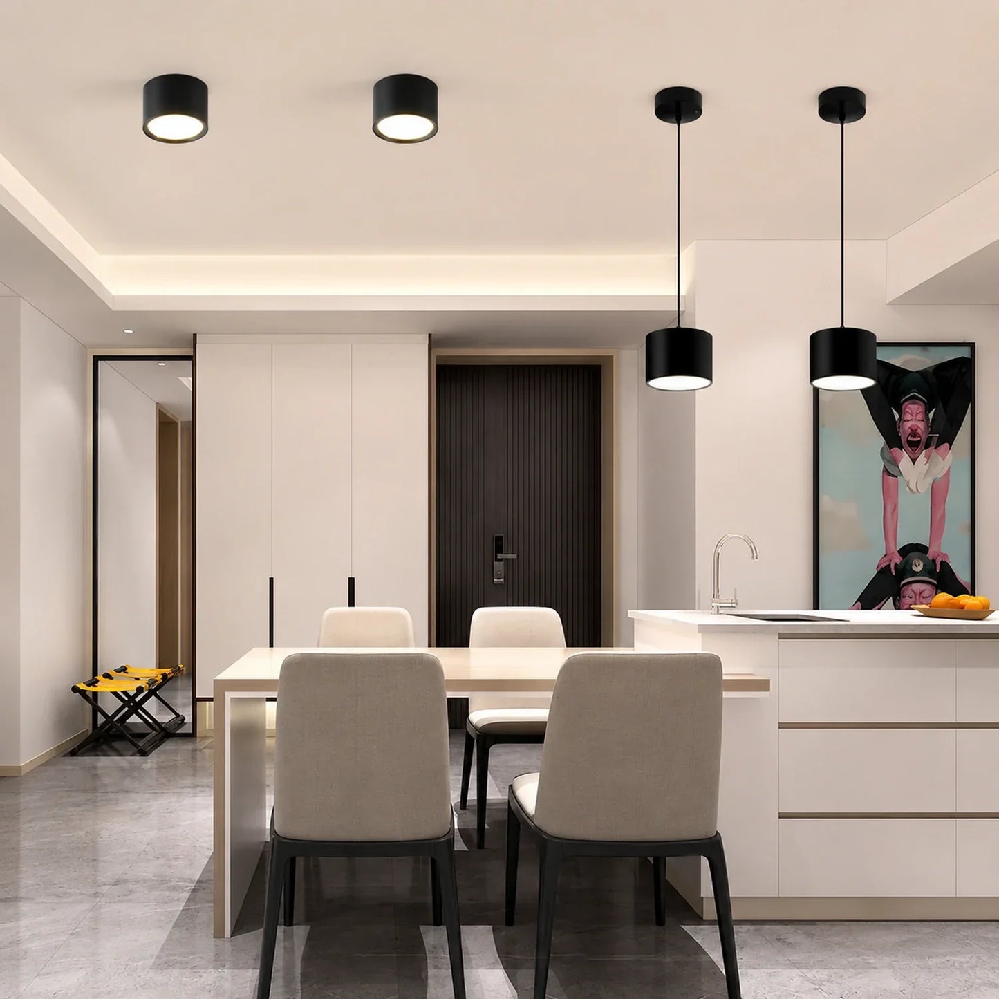 Modern dining area illuminated by black surface-mounted cylindrical LED downlights and matching pendant lights over the kitchen island.