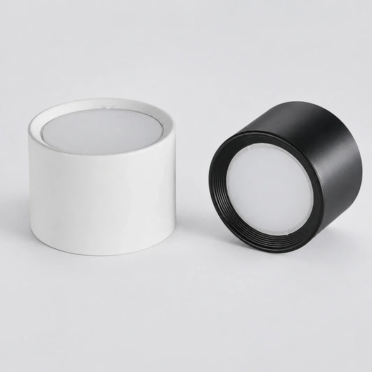 Modern LED ceiling lights in white and black. These minimalist, surface-mounted aluminium downlights are ideal for contemporary indoor lighting.
