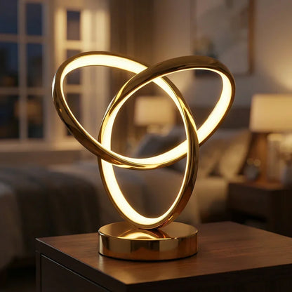 Gold three-ring LED desk lamp detail