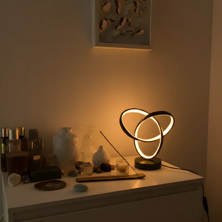 Spiral LED desk lamp on a dresser