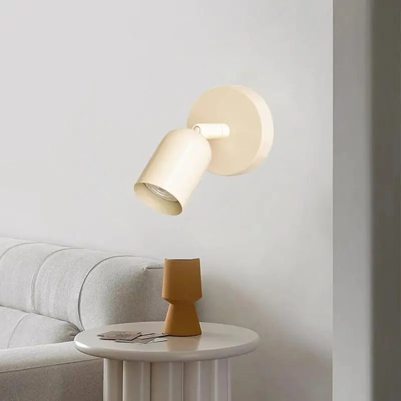 Compact indoor wall spotlight in painted iron