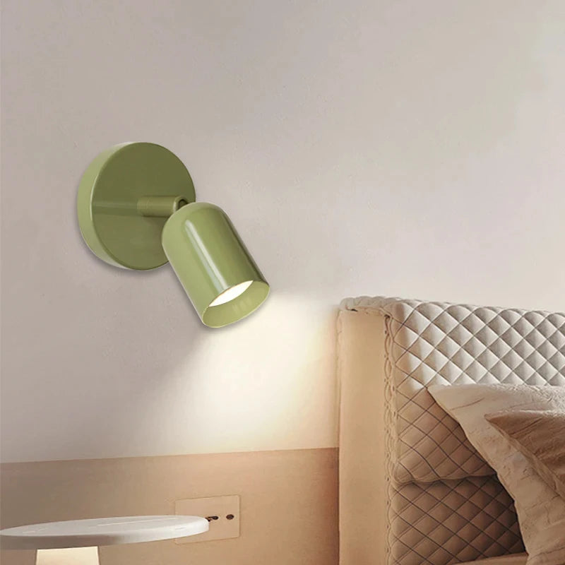 Modern wall light with downward-facing spotlight shade
