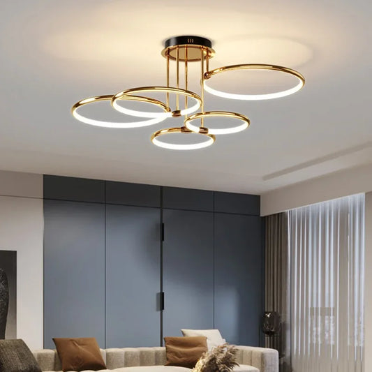 Gold multi-ring LED semi-flush ceiling light in a living room