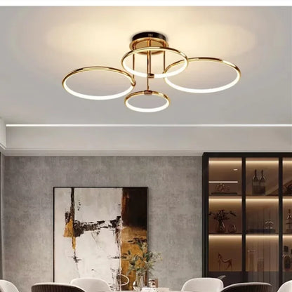 Gold four-ring LED ceiling light in a living room