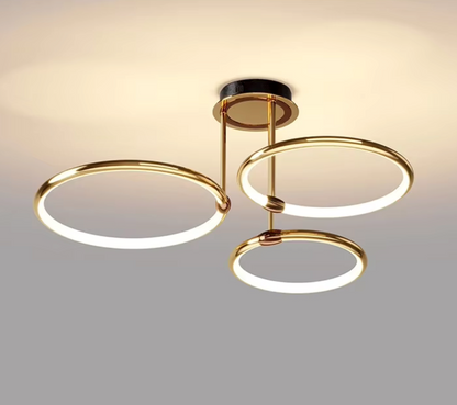Gold three-ring LED ceiling light viewed from below