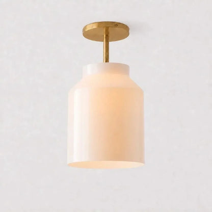 Milk glass ceiling light with antique brass stem