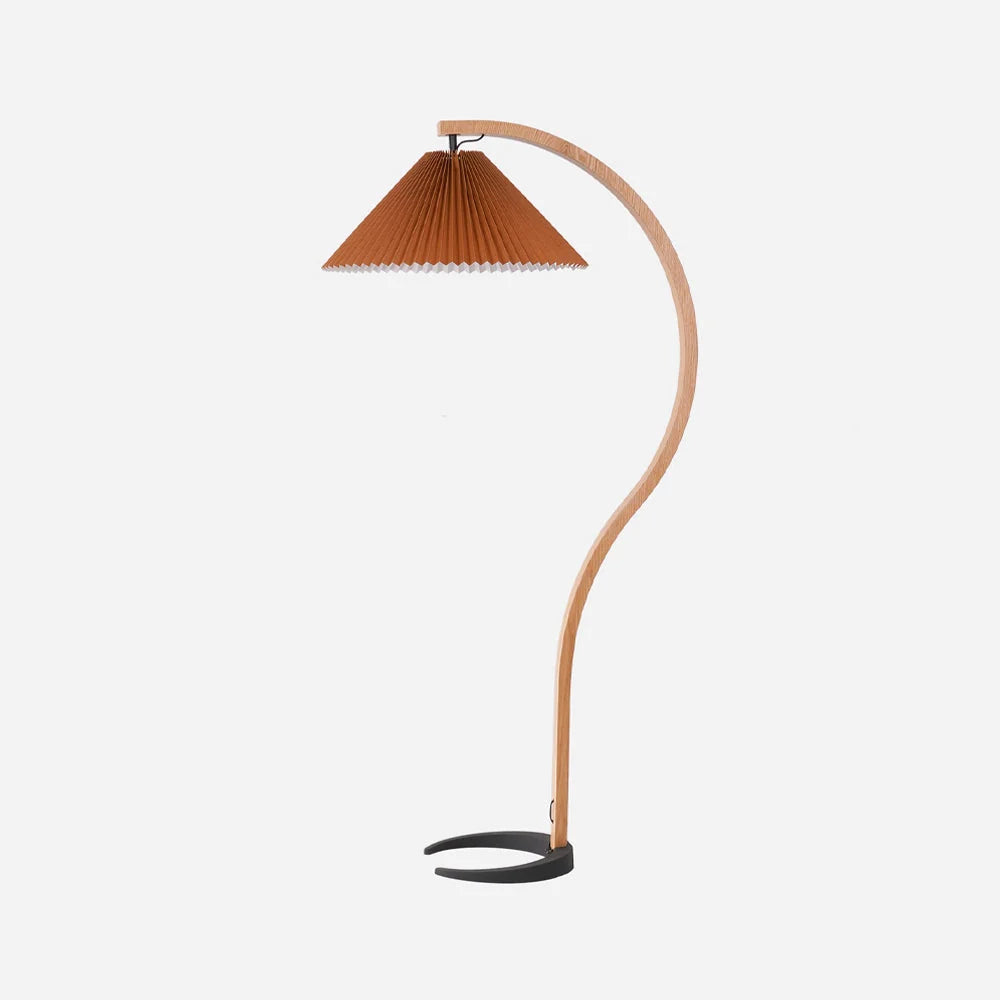 Nordic style floor lamp featuring a curved beech wood stand, a black crescent base, and a brown pleated conical shade against a plain white background.