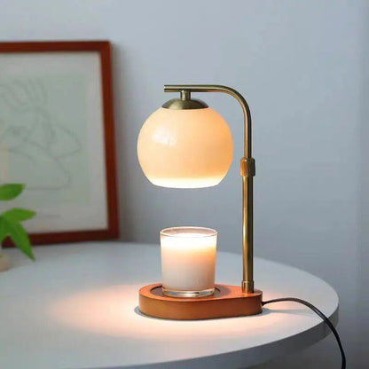 Illuminated Nordic candle warmer on a white side table