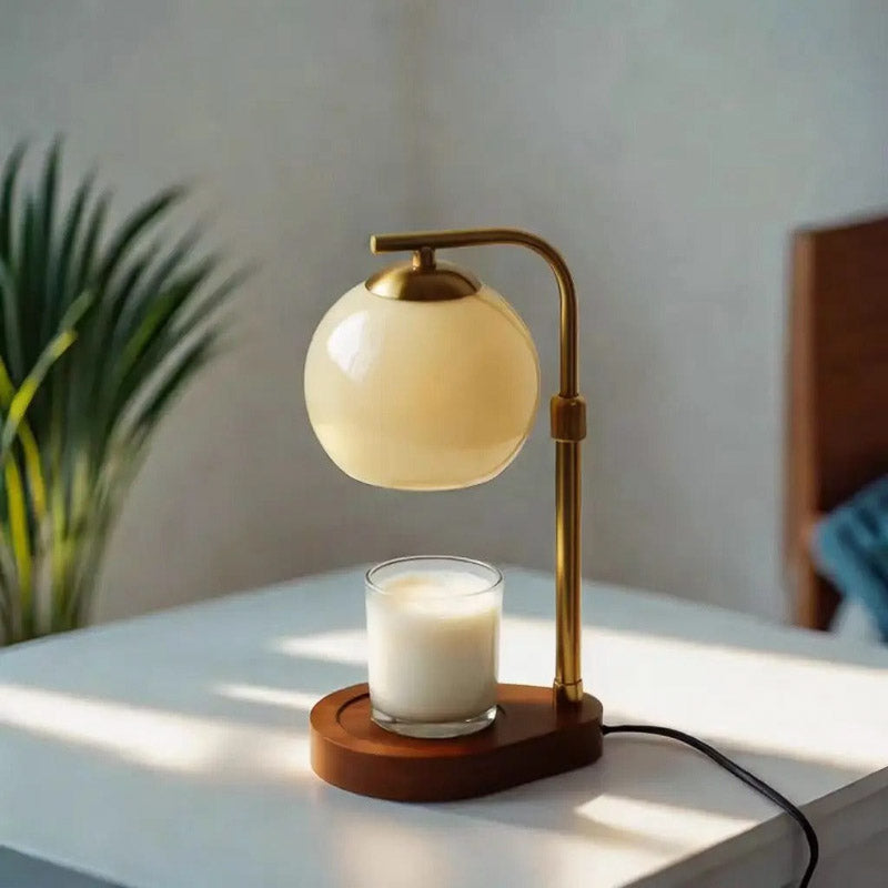 Beige glass candle warmer lamp above a jar candle