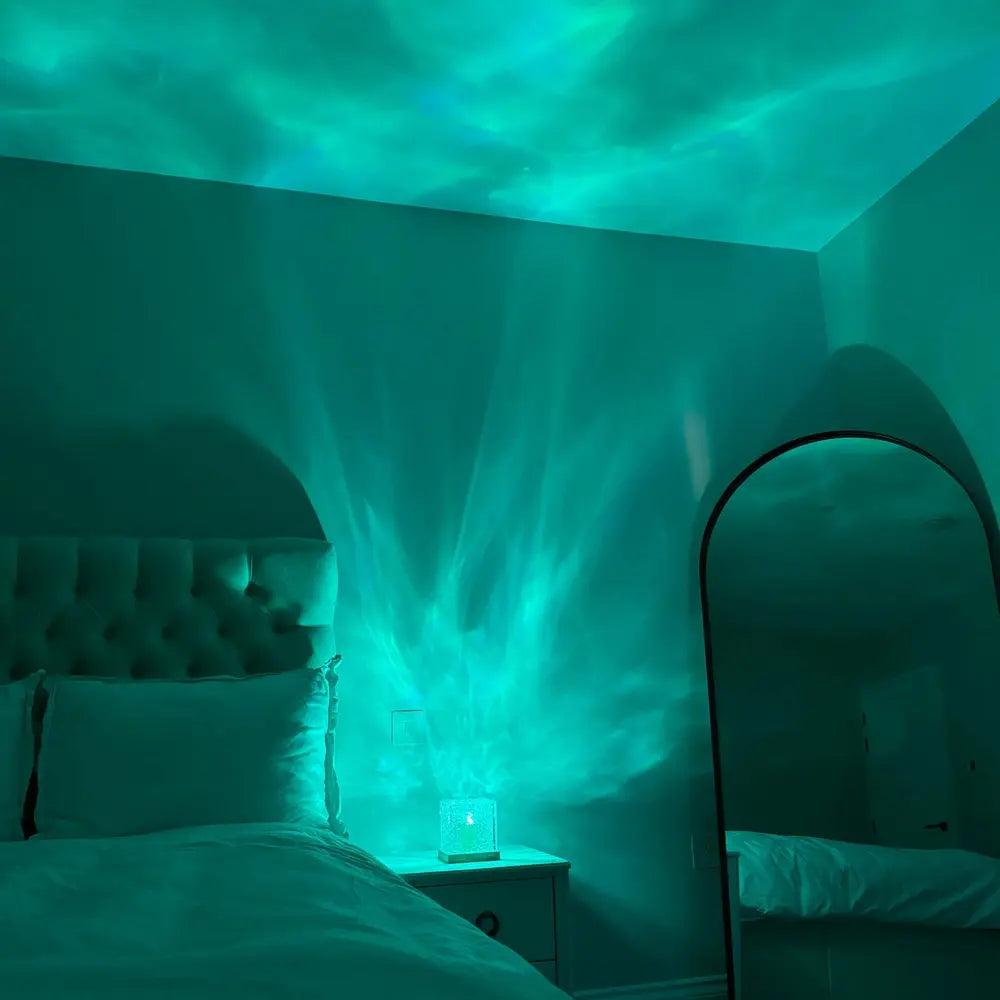 Cube lamp casting turquoise patterns across a bedroom