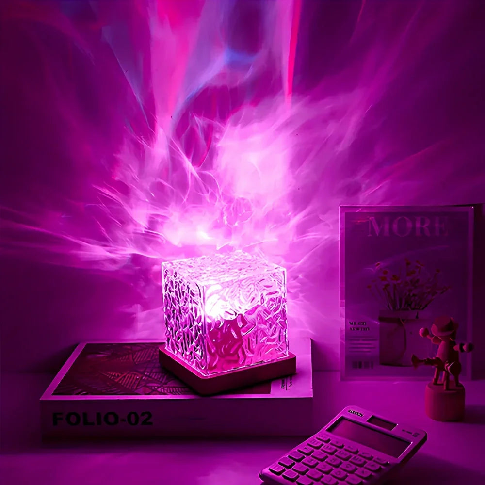 Acrylic cube lamp casting purple light patterns