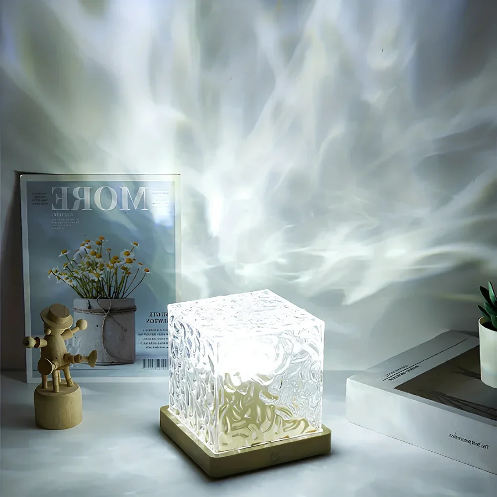 Cube table lamp casting white patterns on a wall