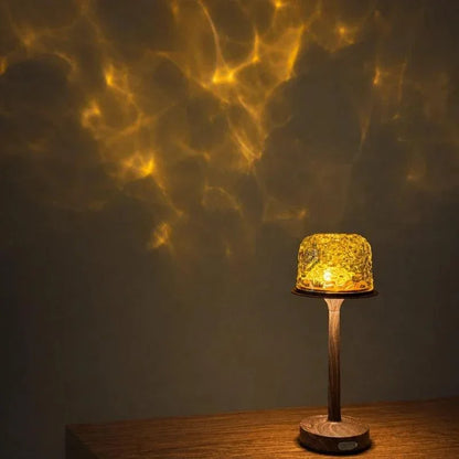 Golden light projected above an oak-finish lamp