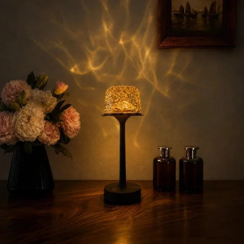 Aurora projector table lamp casting a golden pattern
