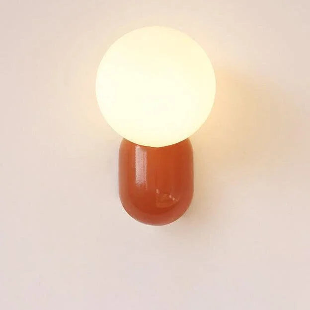 Red opal globe wall sconce close-up