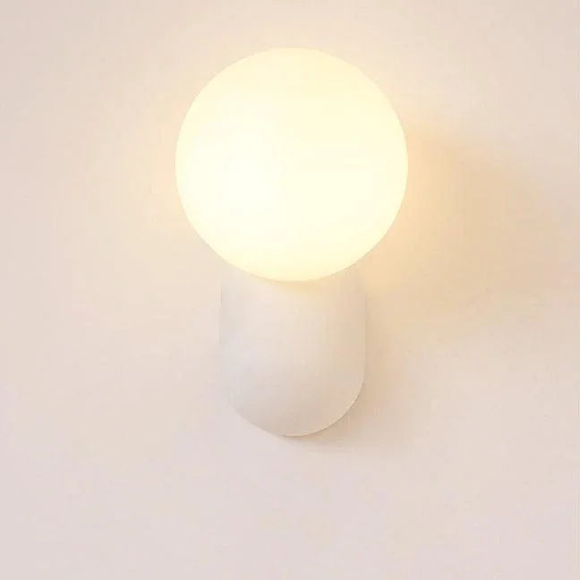 White opal globe wall sconce close-up