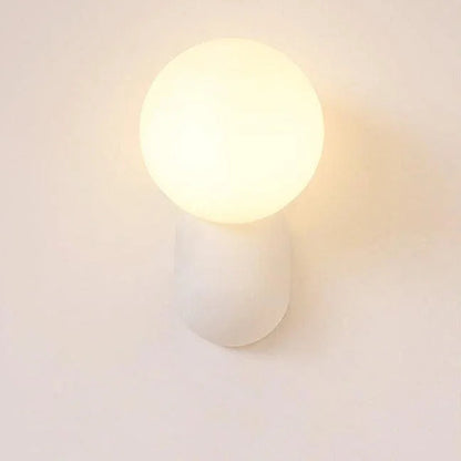 White opal globe wall sconce close-up