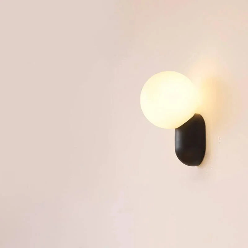Black resin base opal globe wall sconce