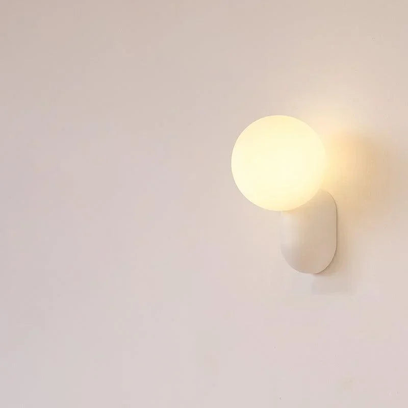 White resin base opal globe wall light