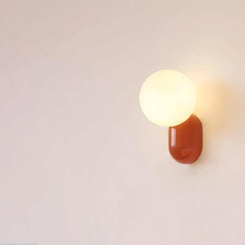 Red resin base opal globe wall light