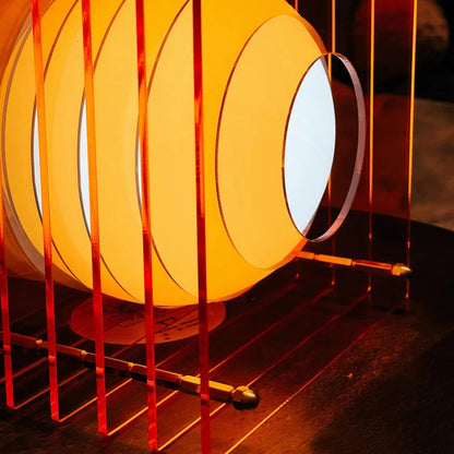 Close-up of orange acrylic cube rechargeable table lamp