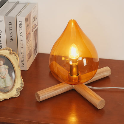 Orange flame-shaped glass table lamp with solid wood cross base 11