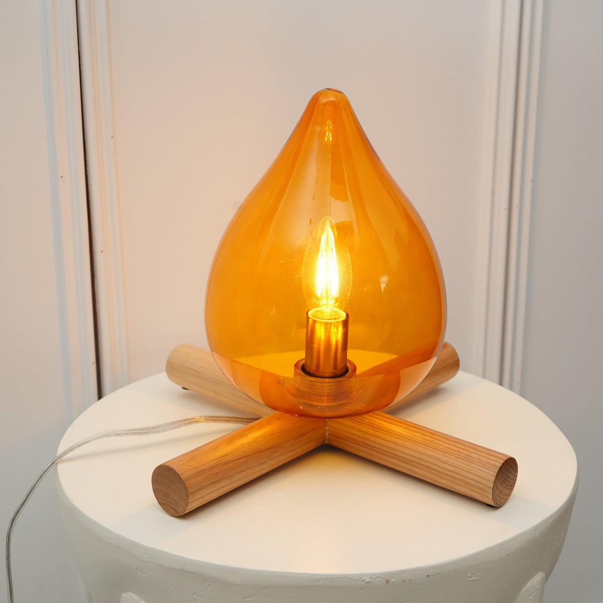 Orange flame-shaped glass table lamp with solid wood cross base 12