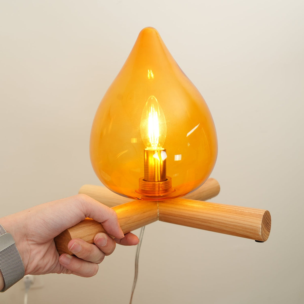 Orange flame-shaped glass table lamp with solid wood cross base 13
