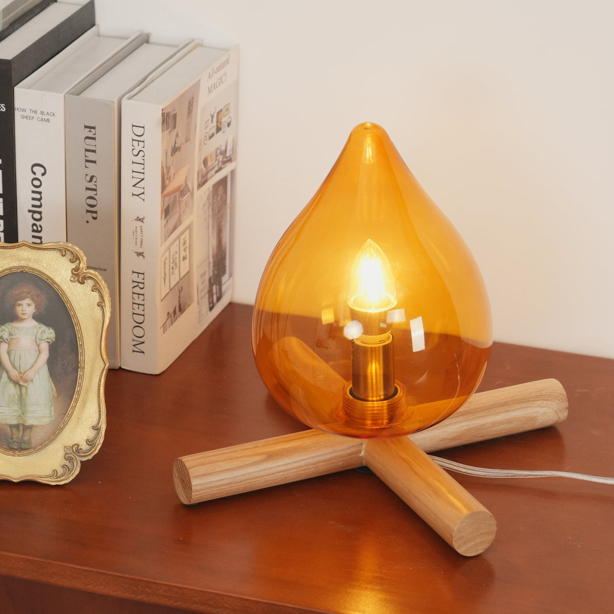 Orange flame-shaped glass table lamp with solid wood cross base 14