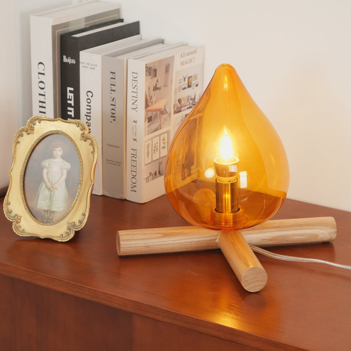 Orange flame-shaped glass table lamp with solid wood cross base 16