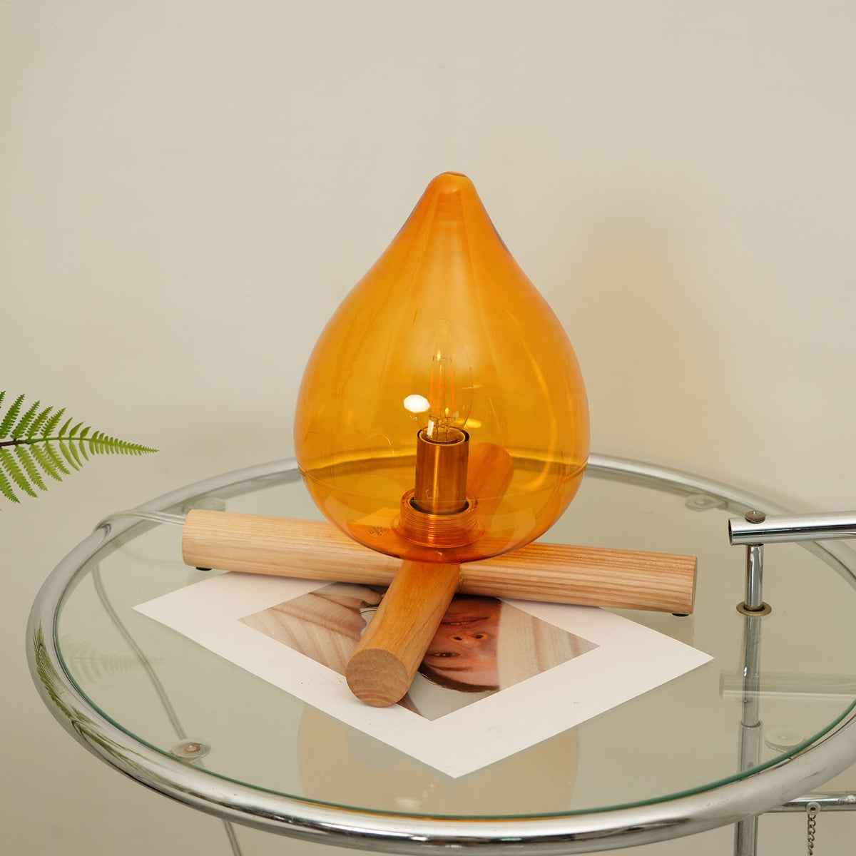 Orange flame-shaped glass table lamp with solid wood cross base 18