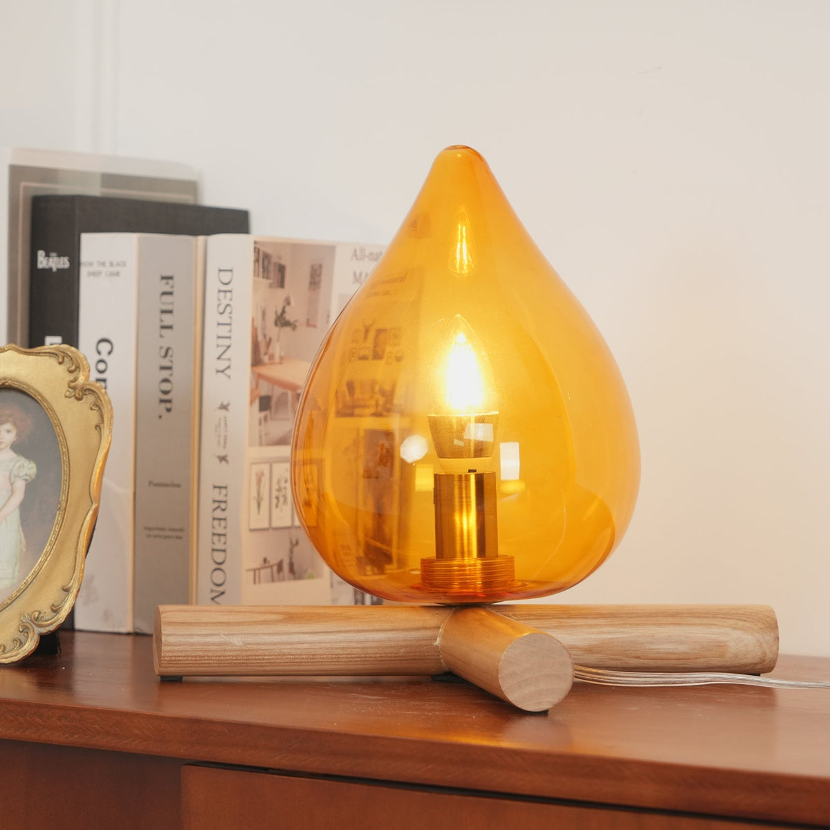 Orange flame-shaped glass table lamp with solid wood cross base 19