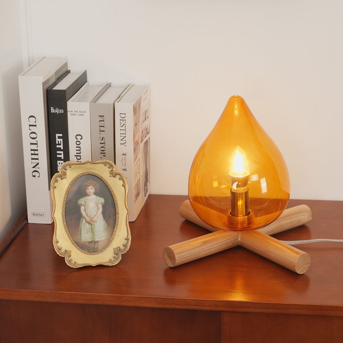 Orange flame-shaped glass table lamp with solid wood cross base 21