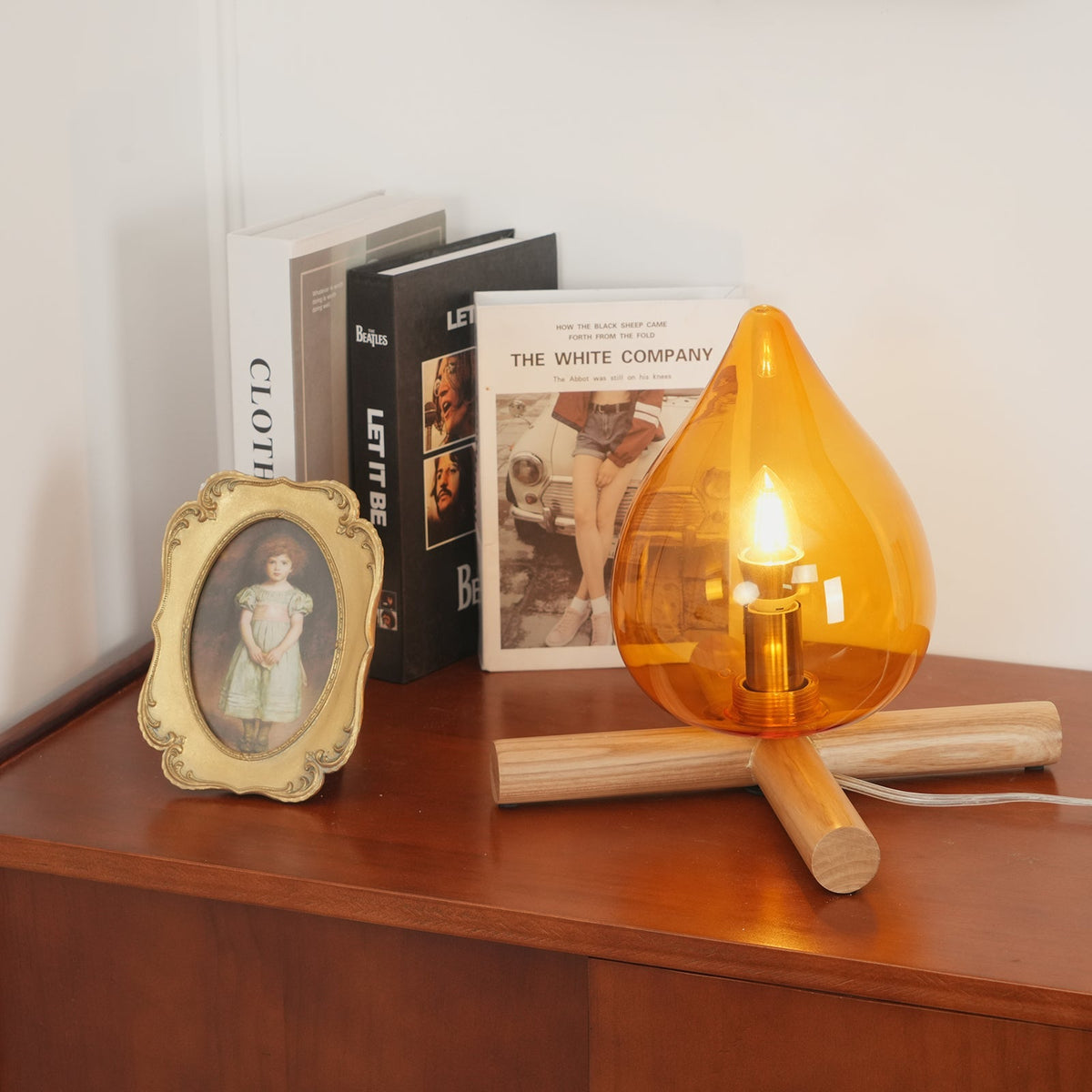 Orange flame-shaped glass table lamp with solid wood cross base 22