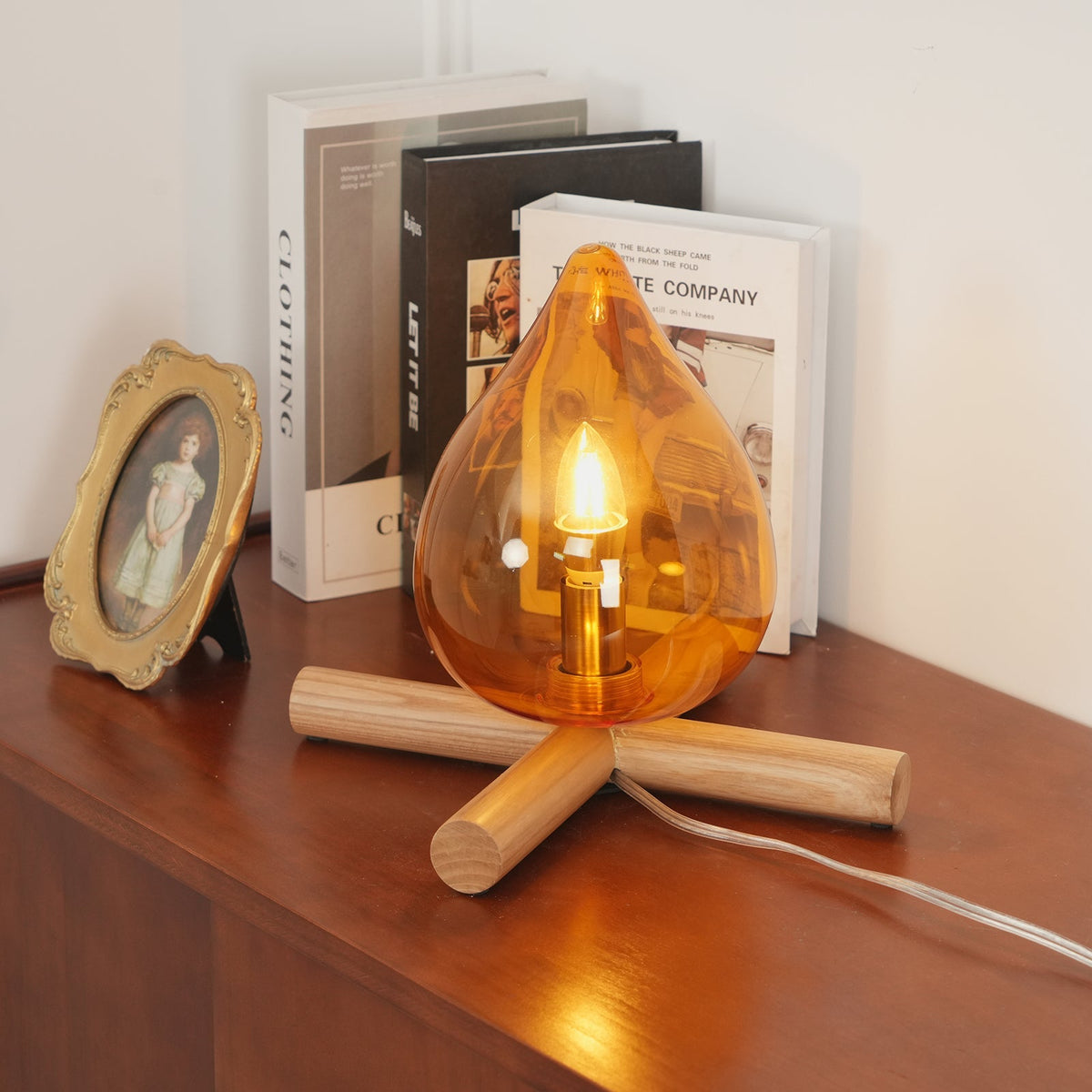 Orange flame-shaped glass table lamp with solid wood cross base 23