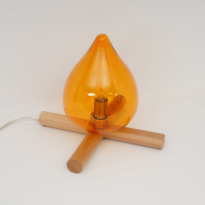 Orange flame-shaped glass table lamp with solid wood cross base 24