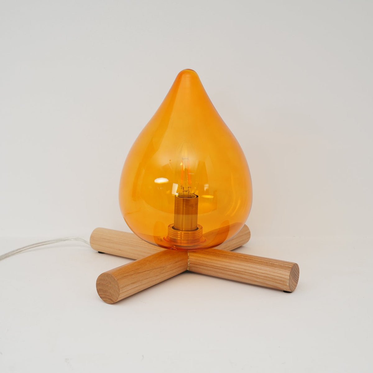 Orange flame-shaped glass table lamp with solid wood cross base 25