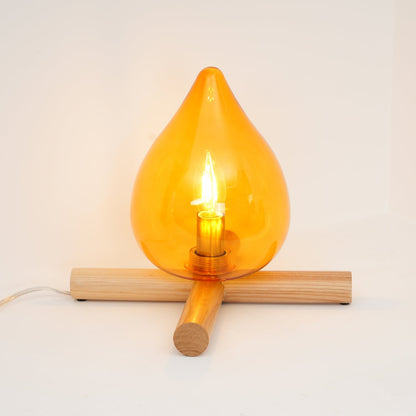 Orange flame-shaped glass table lamp with solid wood cross base 27