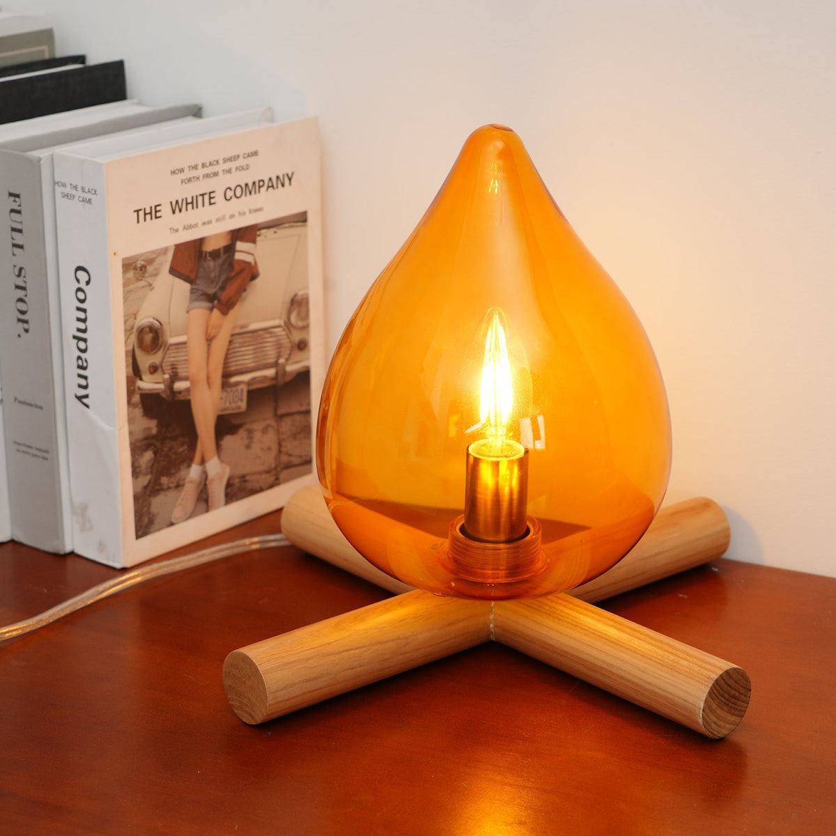 Orange flame-shaped glass table lamp with solid wood cross base 28