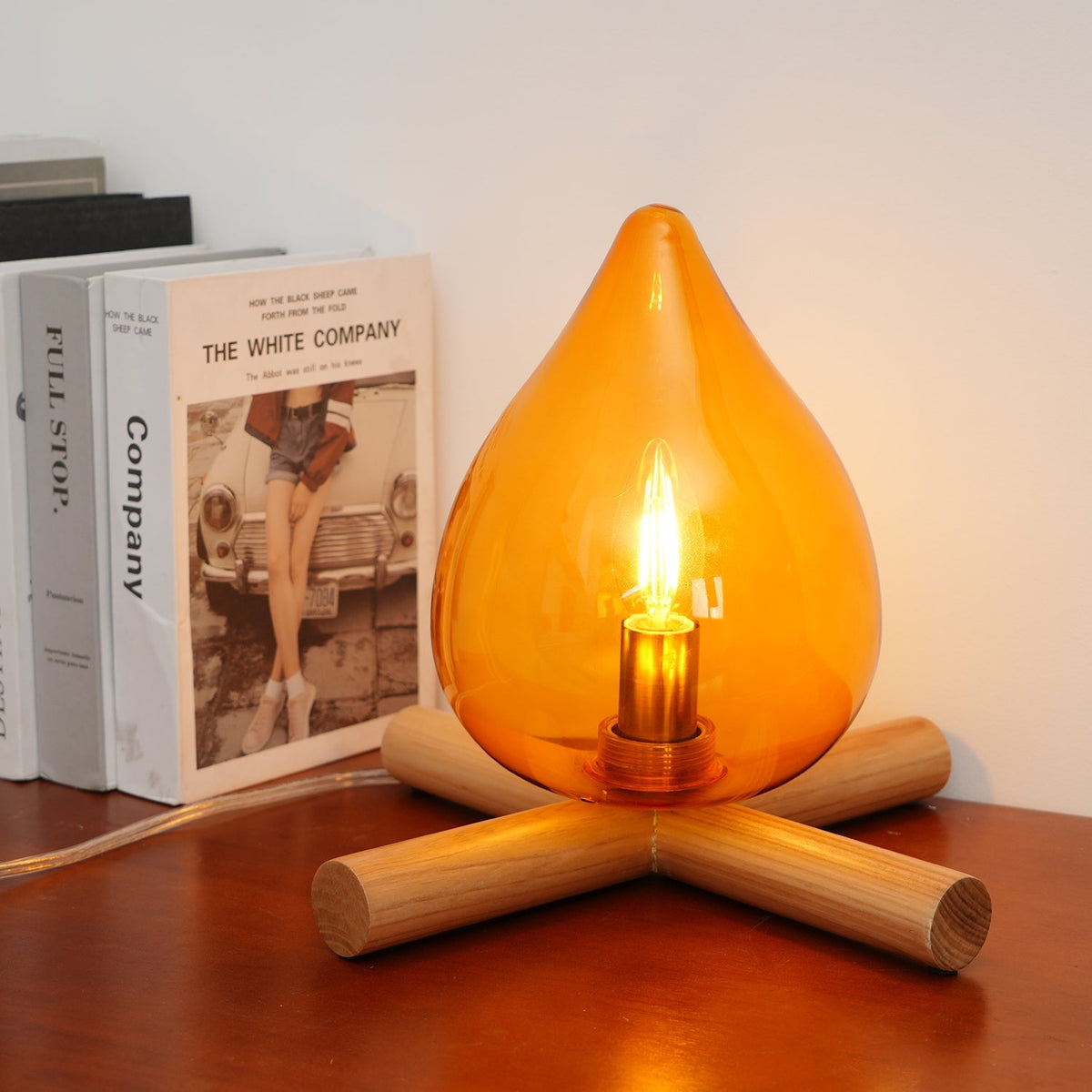 Orange flame-shaped glass table lamp with solid wood cross base 29