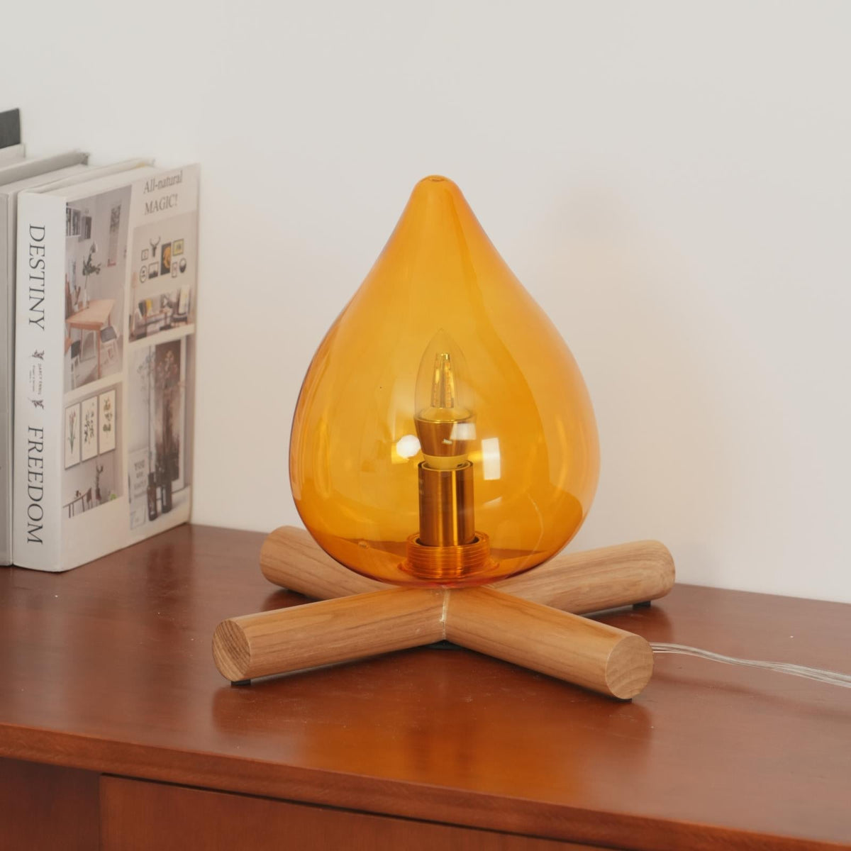 Orange flame-shaped glass table lamp with solid wood cross base 32