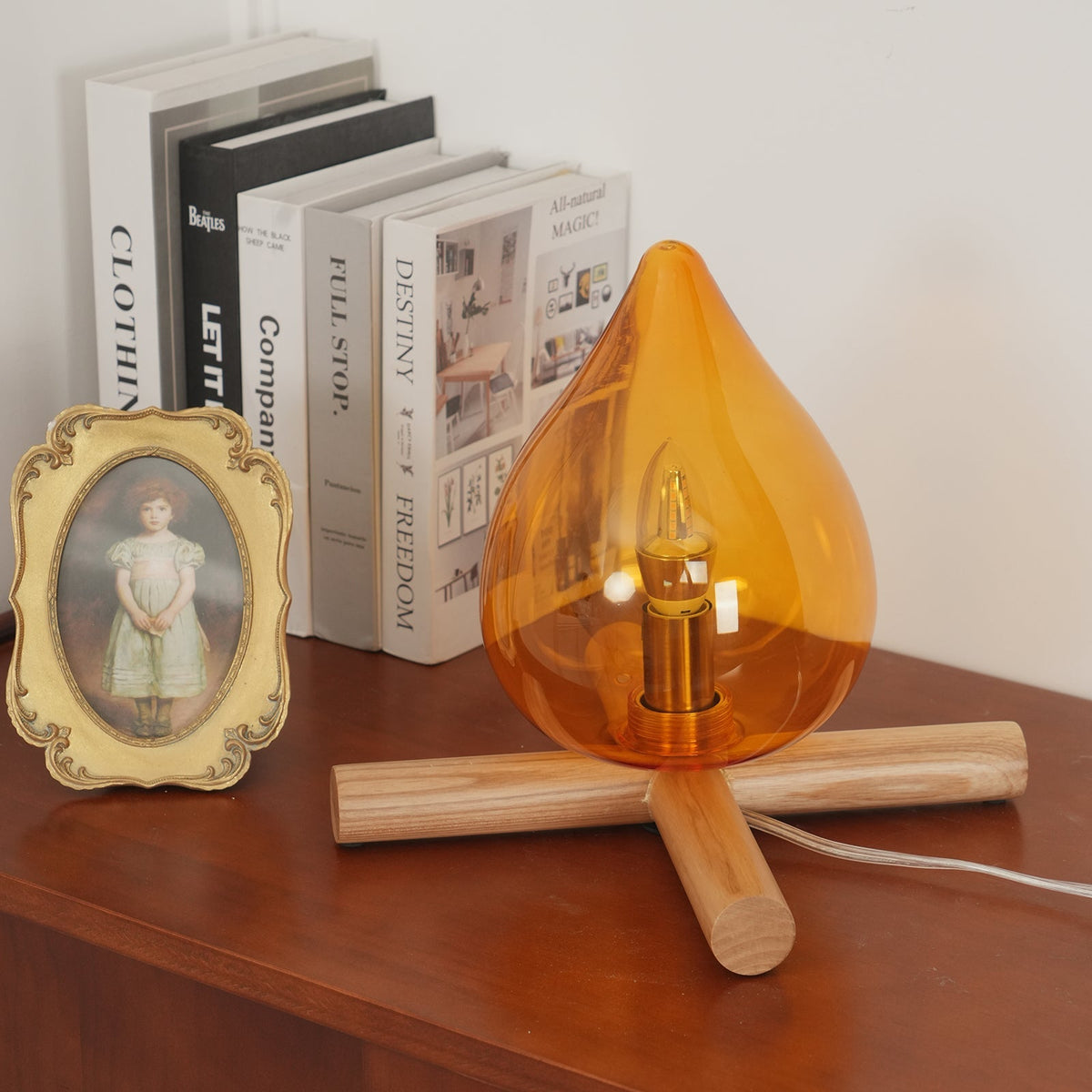 Orange flame-shaped glass table lamp with solid wood cross base 33