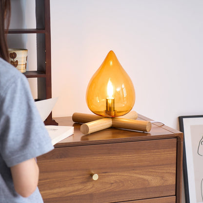 Orange flame-shaped glass table lamp with solid wood cross base 38